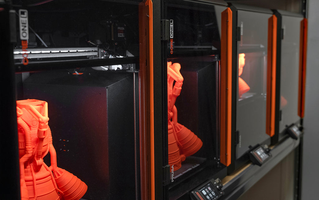 Two CORE One L+ printers running a production job