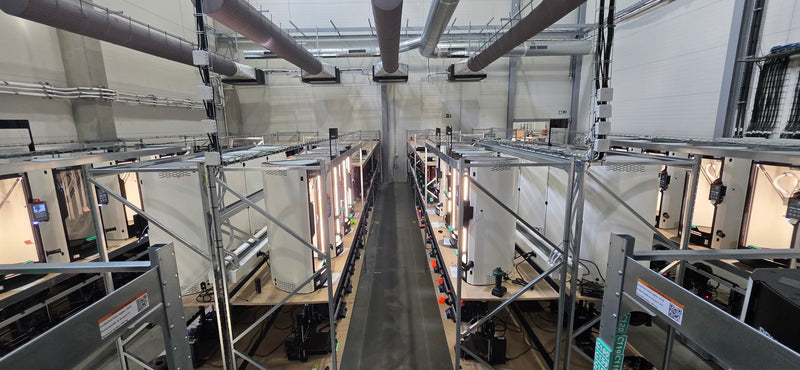 A rack of Original Prusa printers in a customer print farm