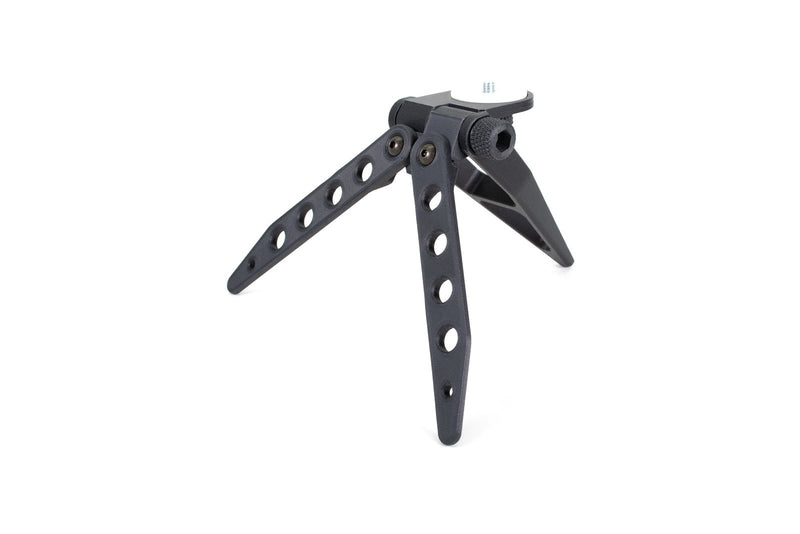 Camera tripod printed in Prusament PC Blend Carbon Fiber on a white background
