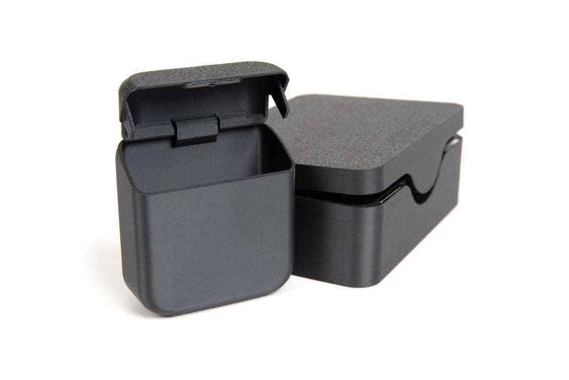 Magnetic-closure boxes printed in Prusament PETG Magnetite 40% on a white background